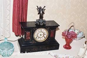 Antique clock, etc. on table